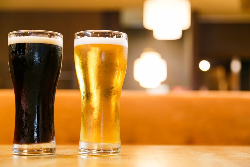 Two glasses of fresh cold beer. A glass dark and light.
